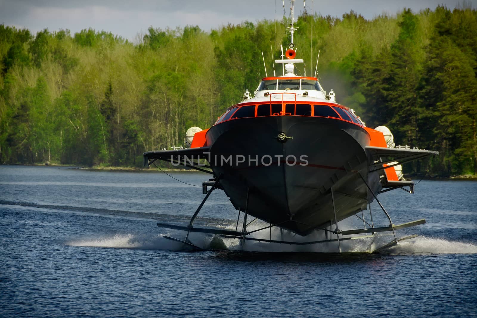 hydrofoil boat on water by mowgli