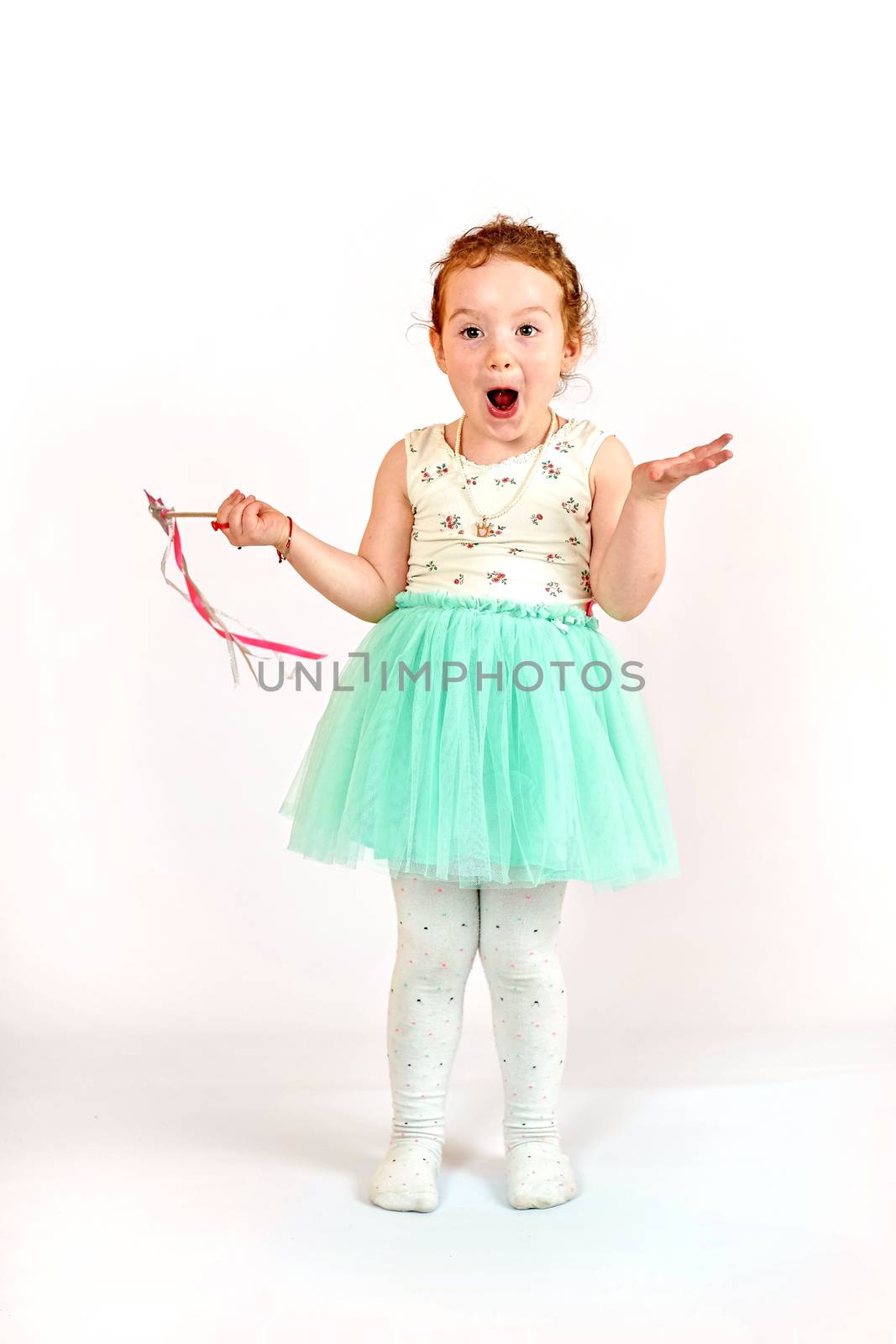 Fashion little girl in green dress, in catwalk model pose, stock photo. Image 02