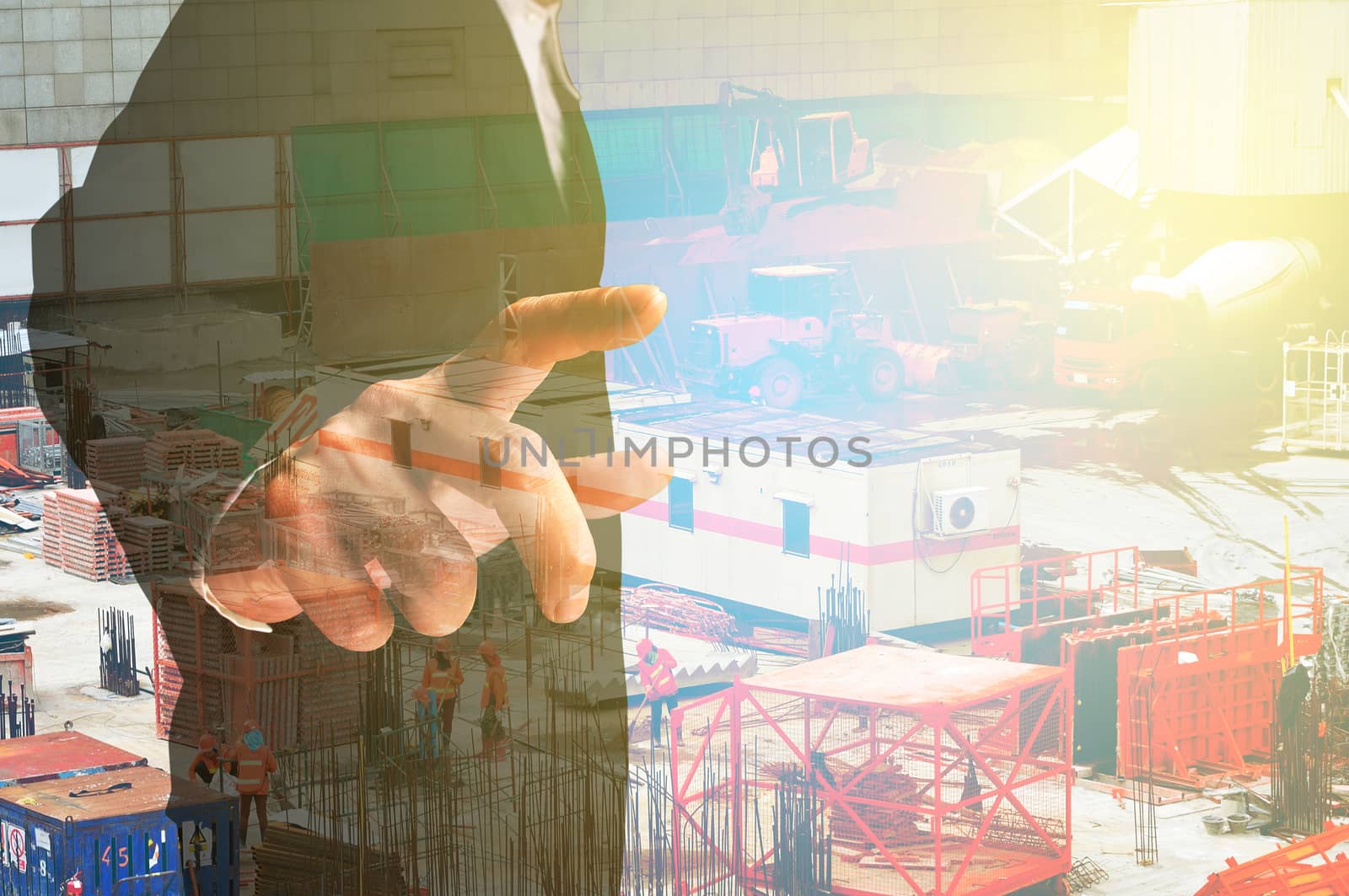 Double exposure of Businessman and Construction site by thampapon