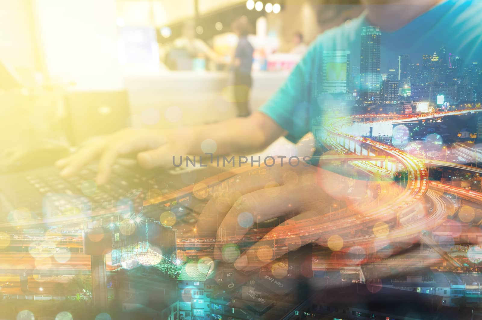 Double Exposure of Man with Laptop Computer and Metro City by thampapon