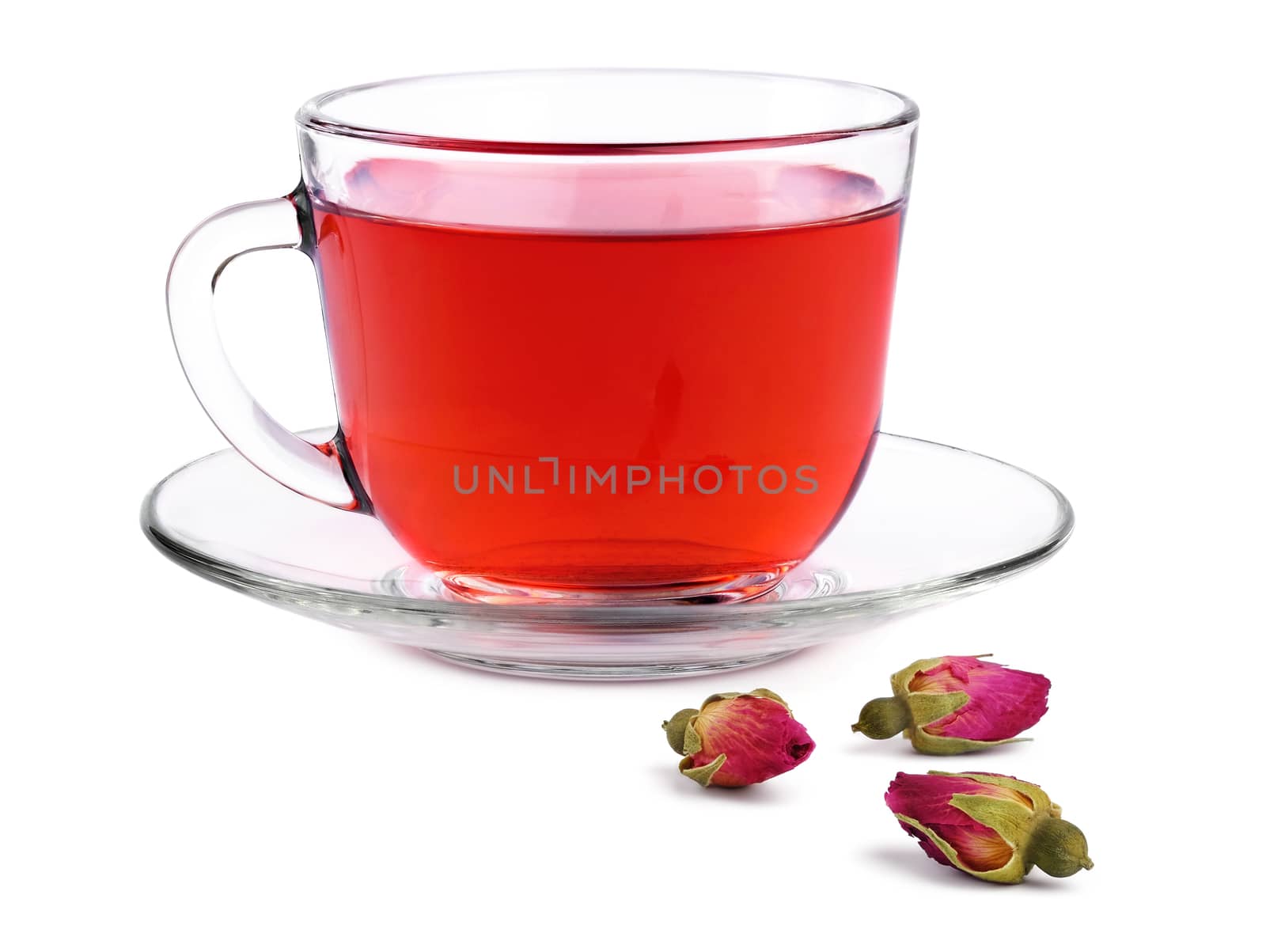 Glass transparent cup of rose tea on a saucer and three buds dried roses isolated on white background.