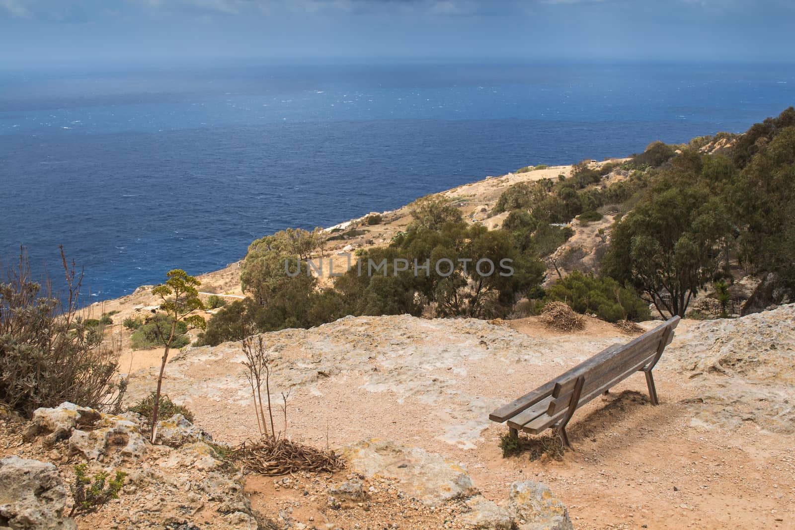 Empty bench with a sea view, Malta by YassminPhoto