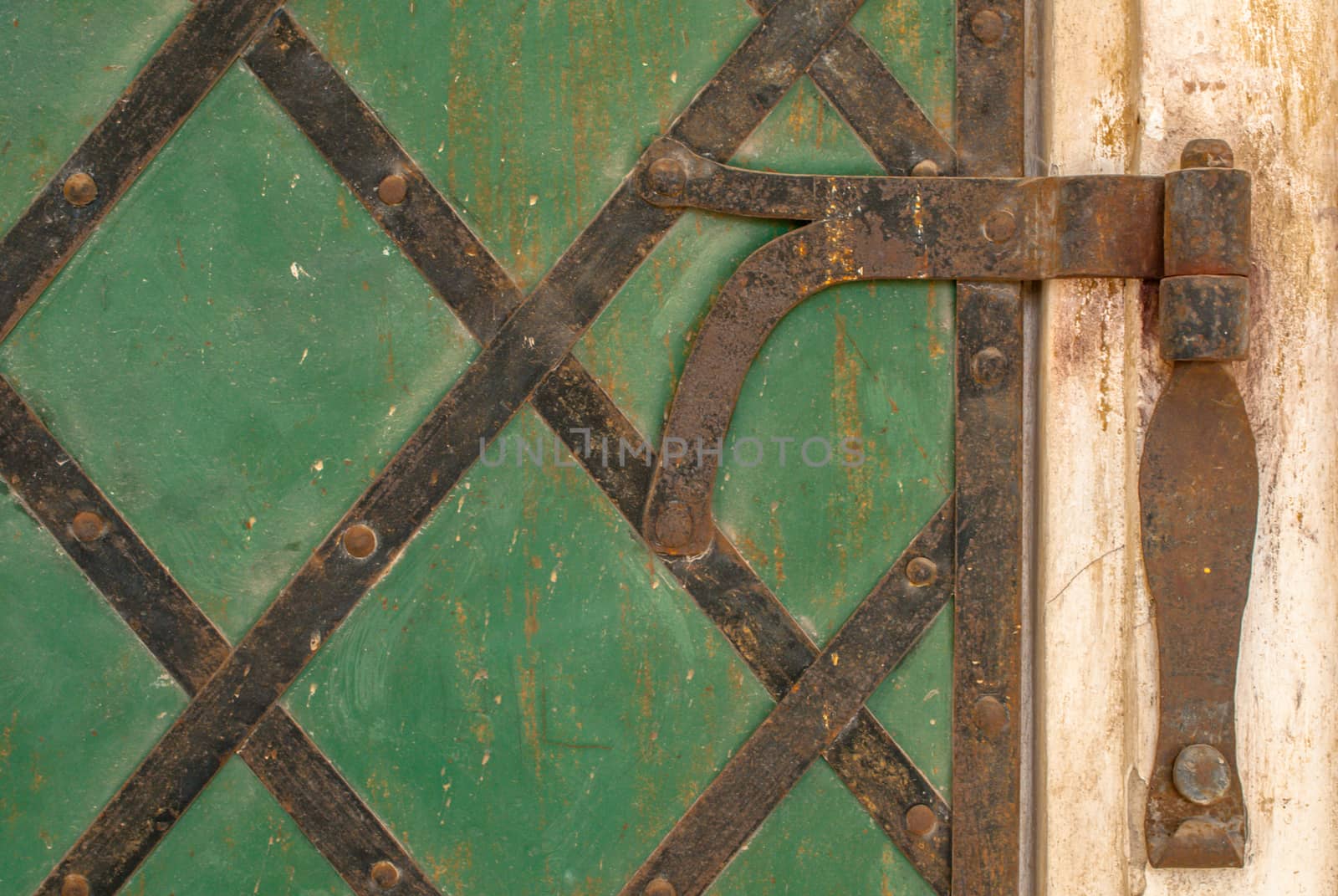 old metal shutters painted green, perfect background for your concept or project by uvisni