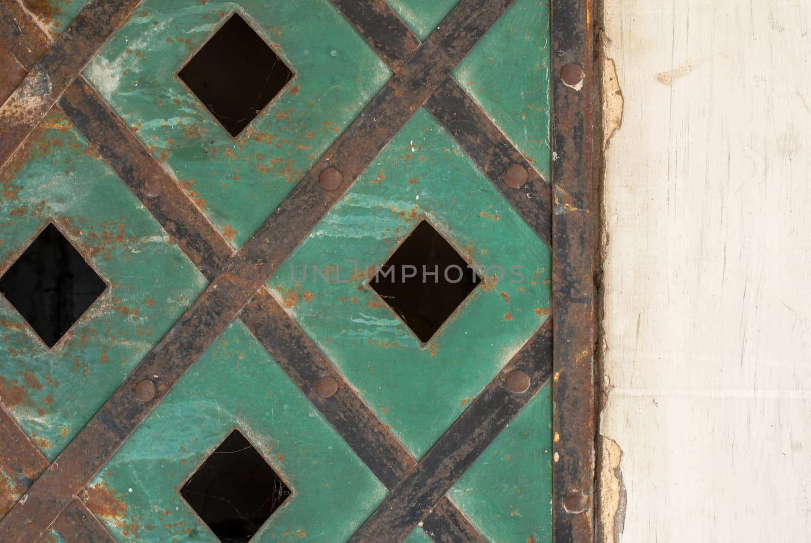 old metal shutters painted green, perfect background for your concept or project by uvisni