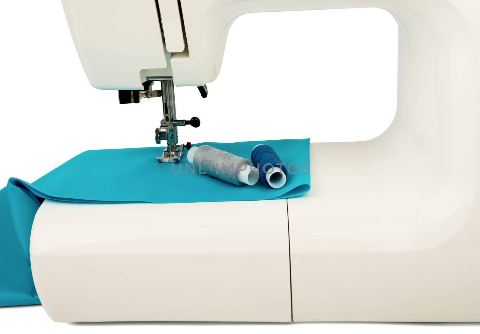 Machine sews with blue textile fabric on white background