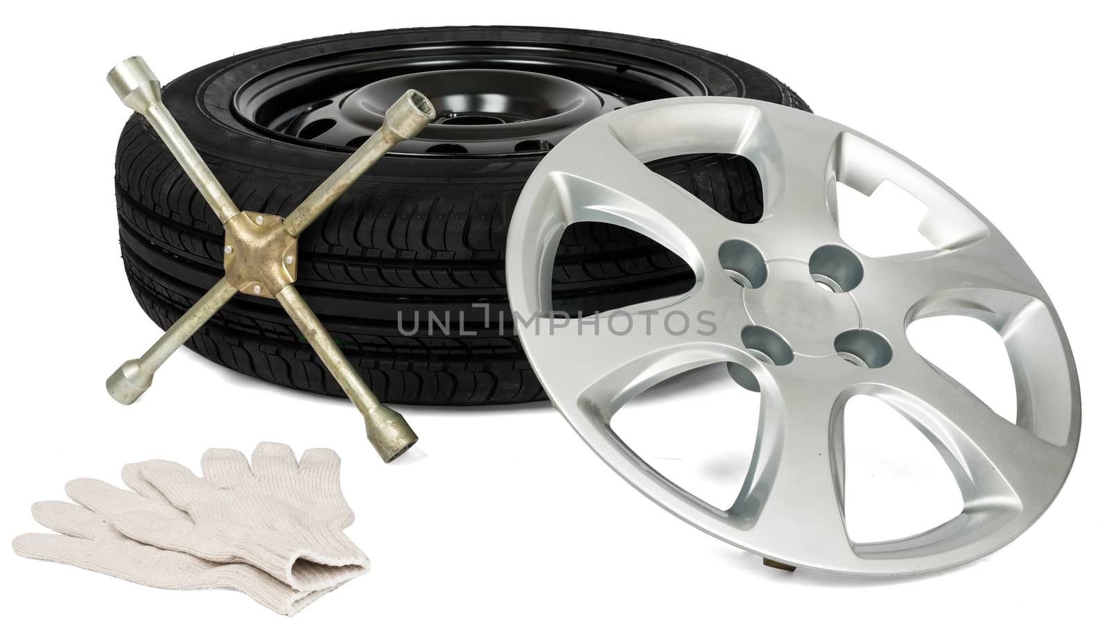Tyre with screwdriver, glove and wheel cap by cherezoff