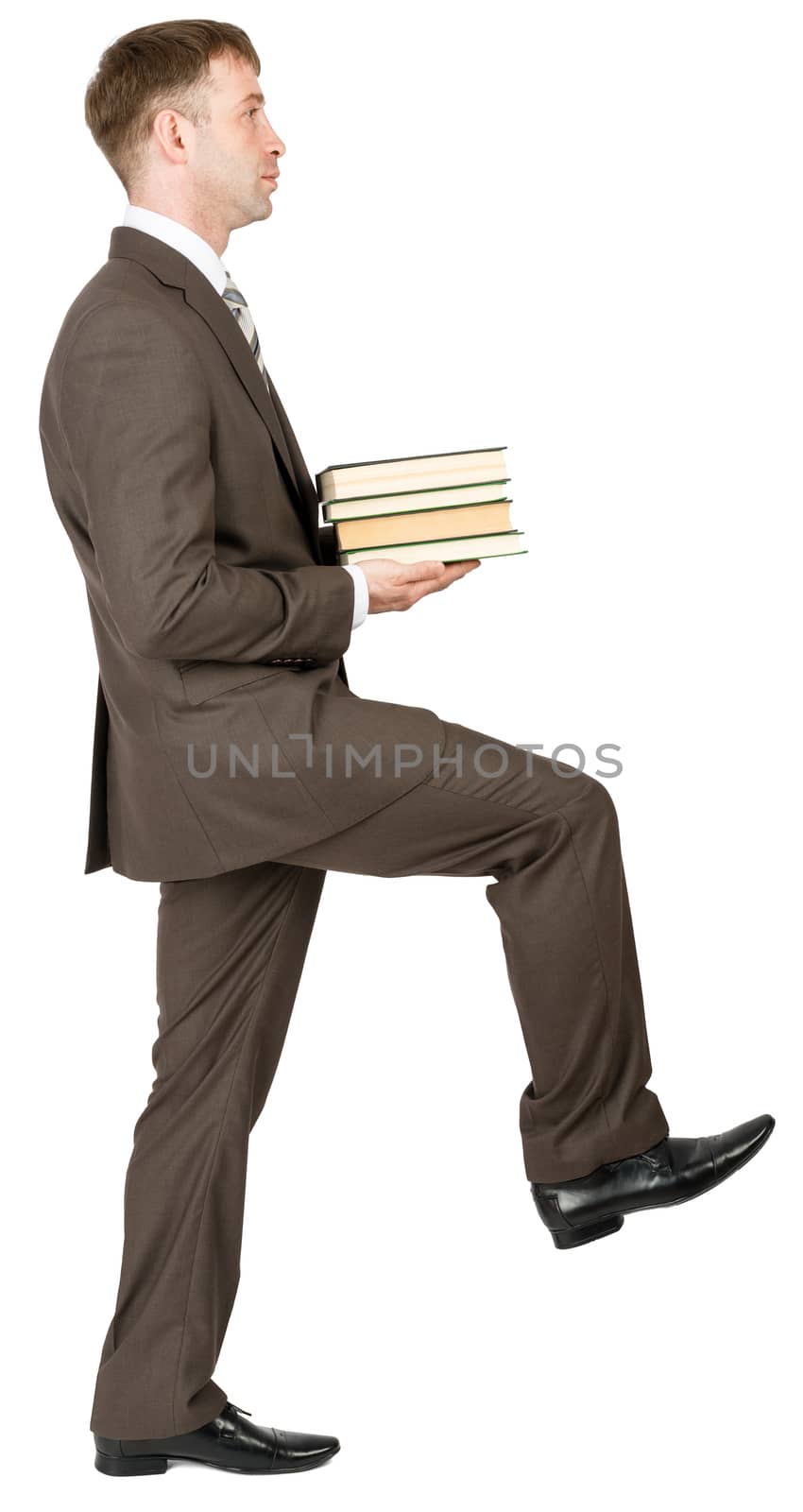 Walking  businessman with books isolated on white background