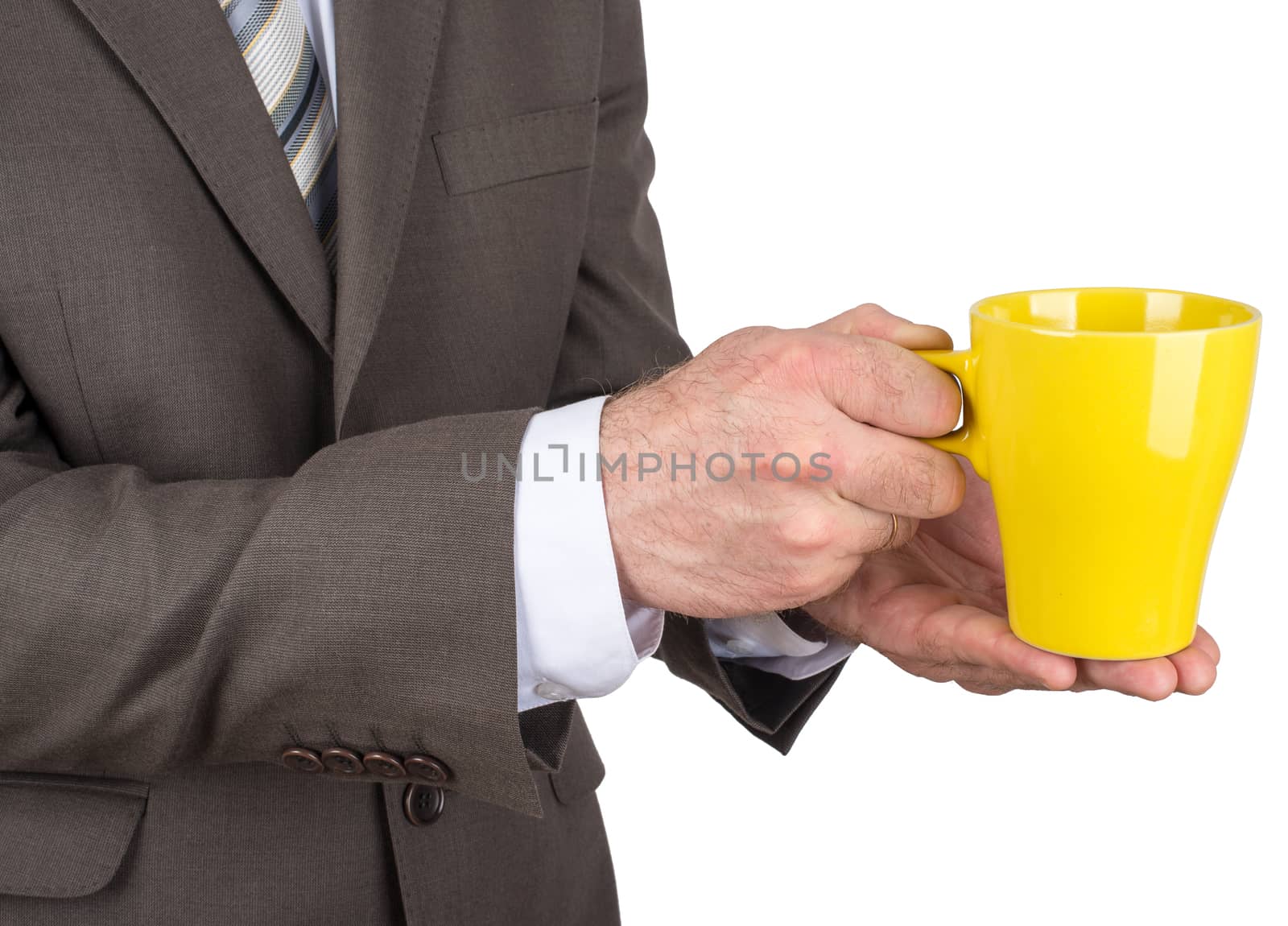 Business man holding yellow cup of black coffee  by cherezoff