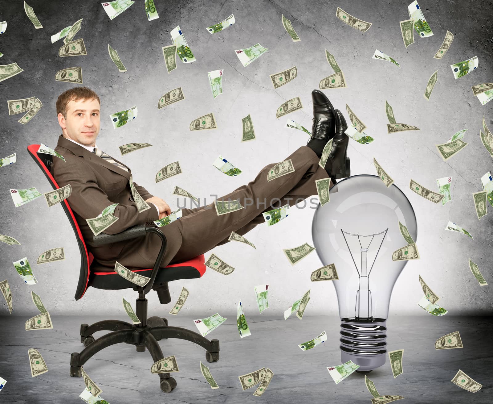 Businessman with light bulb and money rain, idea is money concept