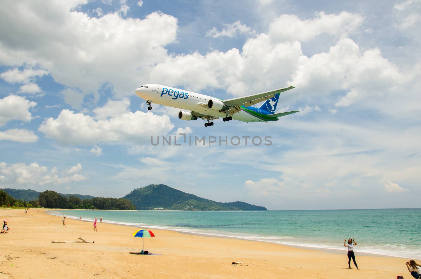 PHUKET - MAY 5 : Pegasus Airlines airplane landing at Phuket International airport, runway near the beach, on May 5, 2016 Phuket, Thailand.