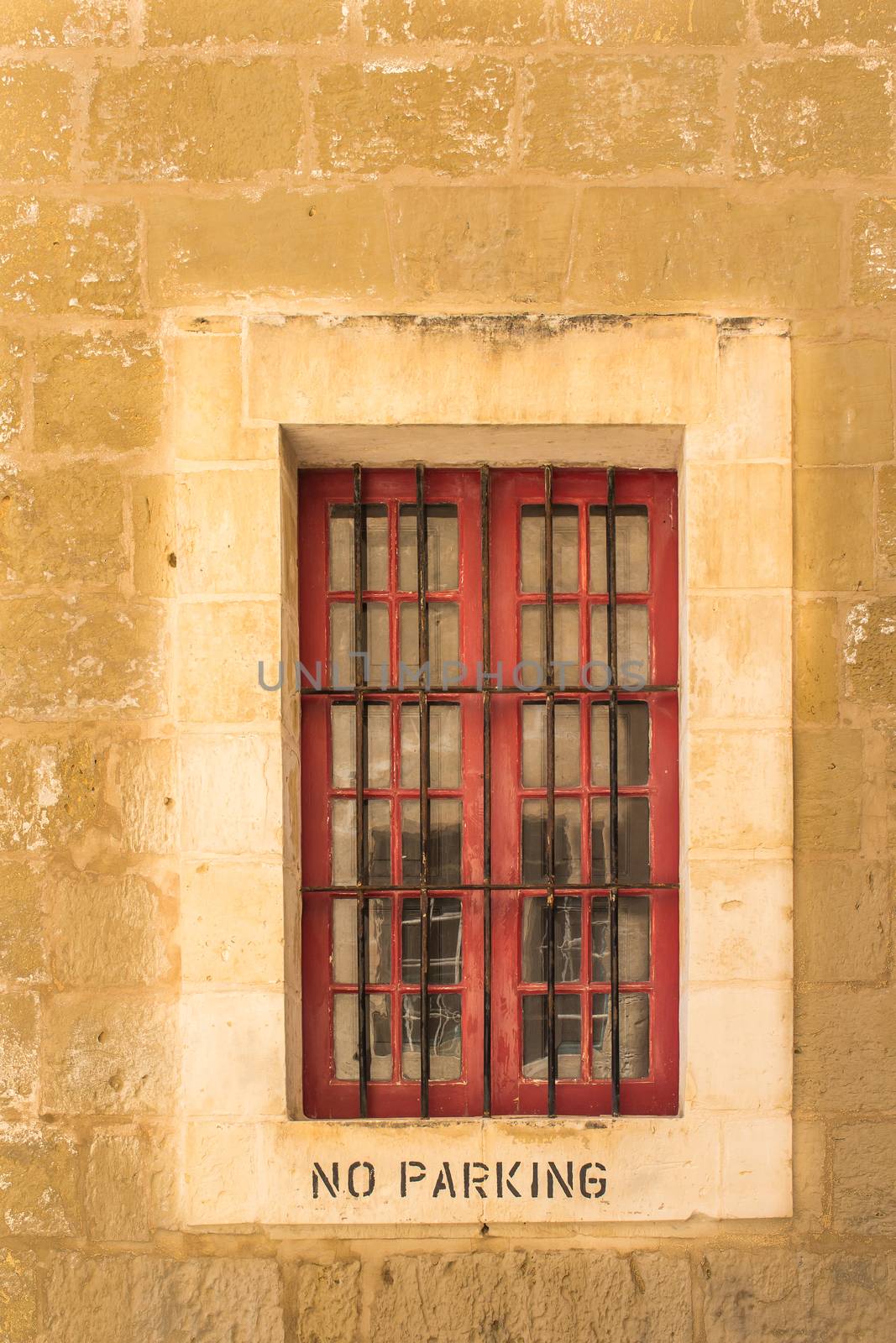 Old window with a No parking instruction by YassminPhoto