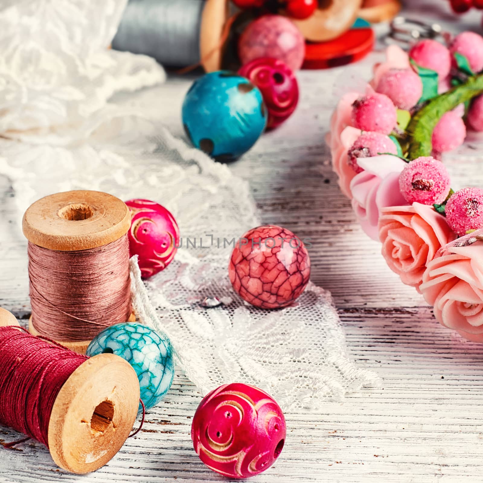 White lace,sewing thread and charming wooden bead