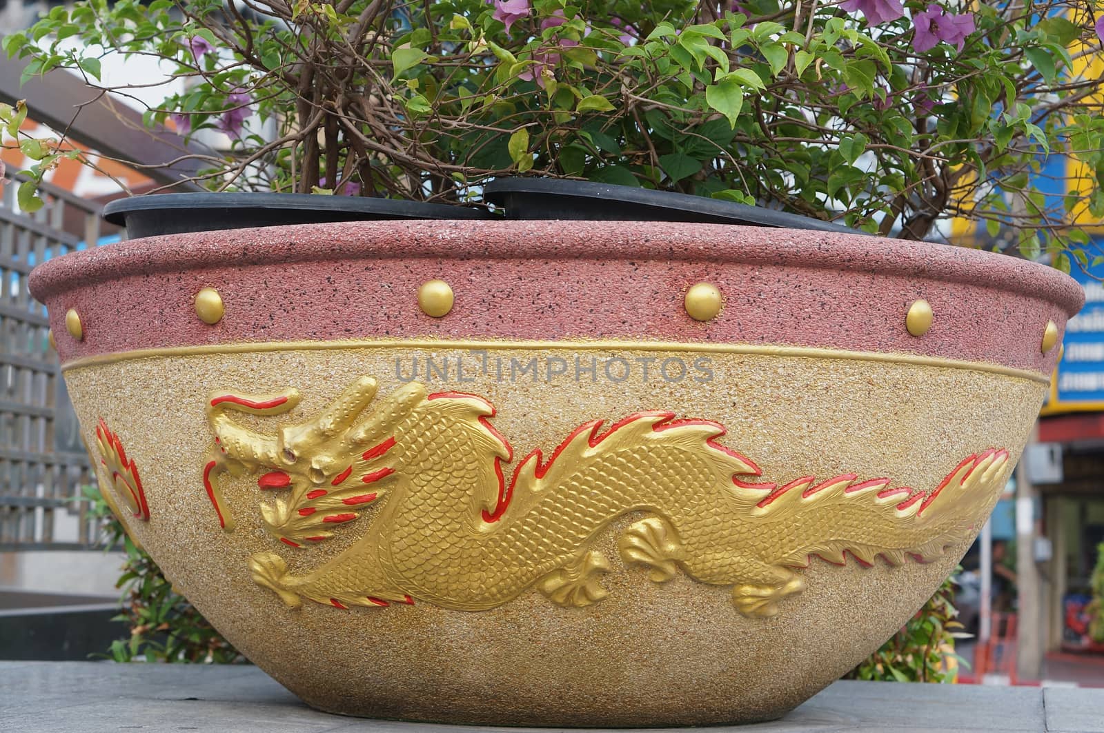 Beautiful of flowerpot dragon pattern was placed at roadside in Thailand.