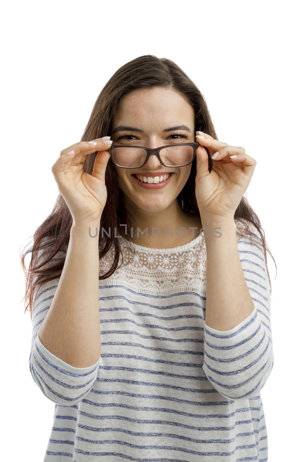 Lovely woman smiling at the camera with her arms folded