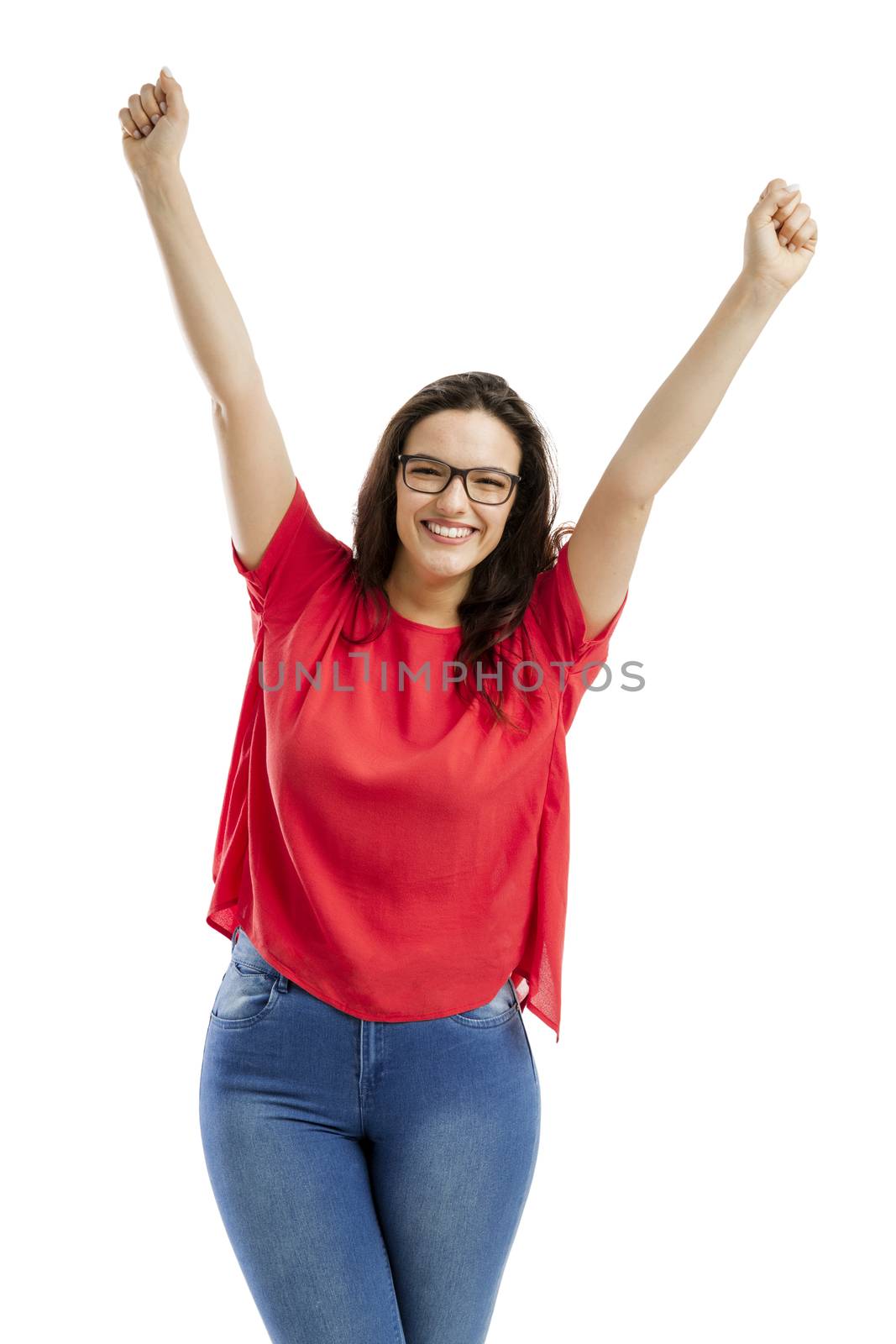 Happy woman with arms up, isolated over white background