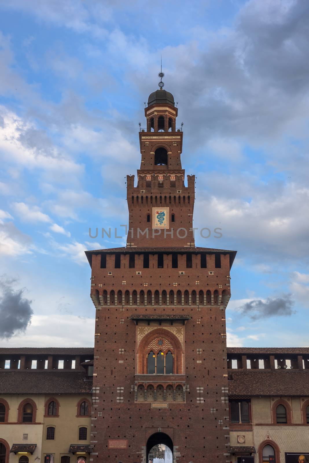 Tower of the Sforza Castle (Castello Sforzesco), a castle in Milan, Italy at twilight.