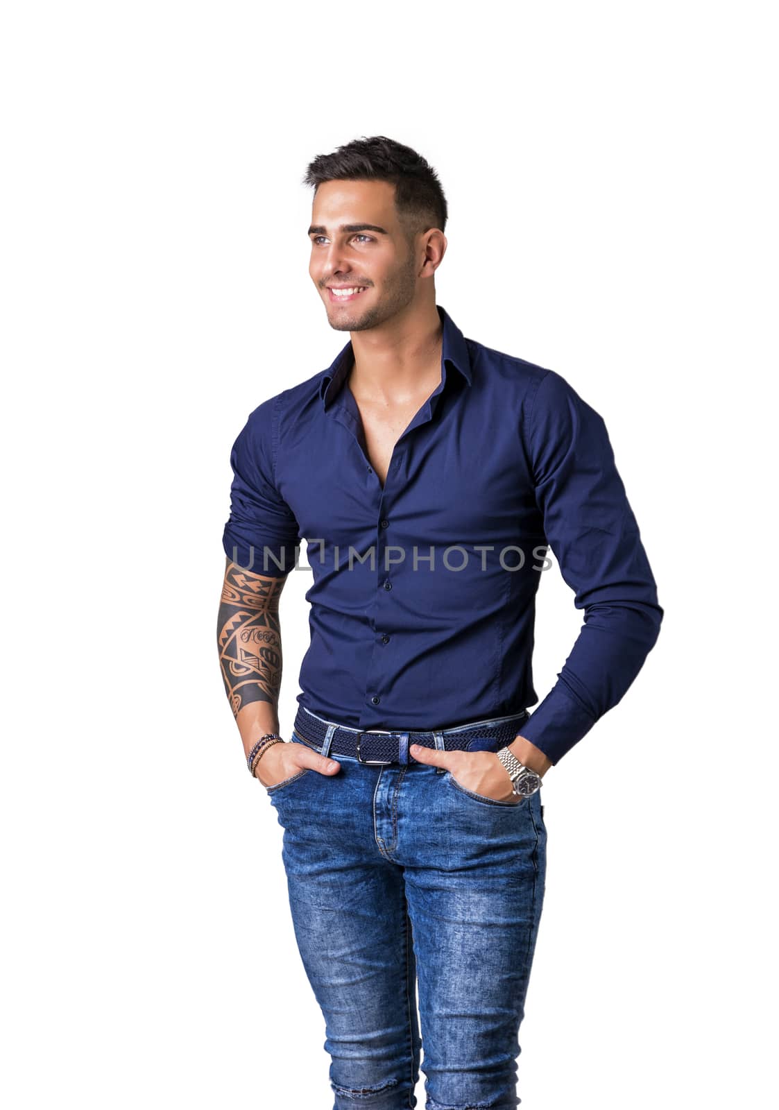 Young smiling man in blue shirt and jeans isolated by artofphoto