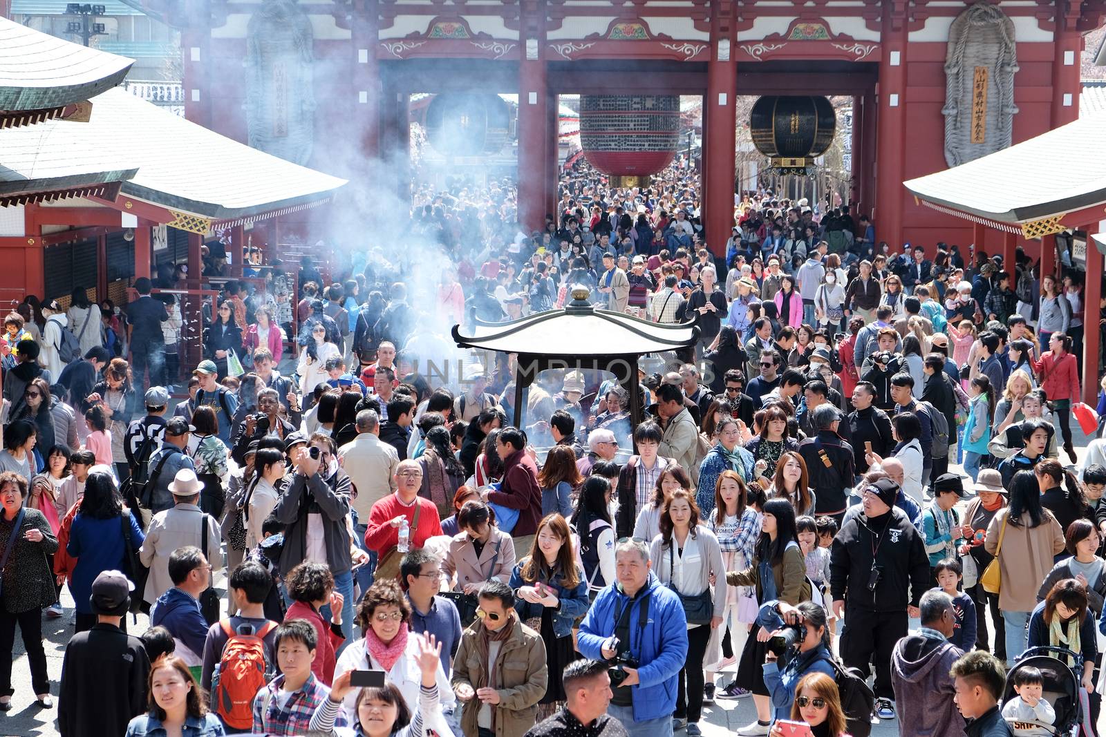 TOKYO, JAPAN - MARCH 29, 2016: unidentified people visit sensoji temple in Tokyo on 29 March 2016.. Sensoji temple is the most famous attraction in Asakusa, Tokyo, Japan