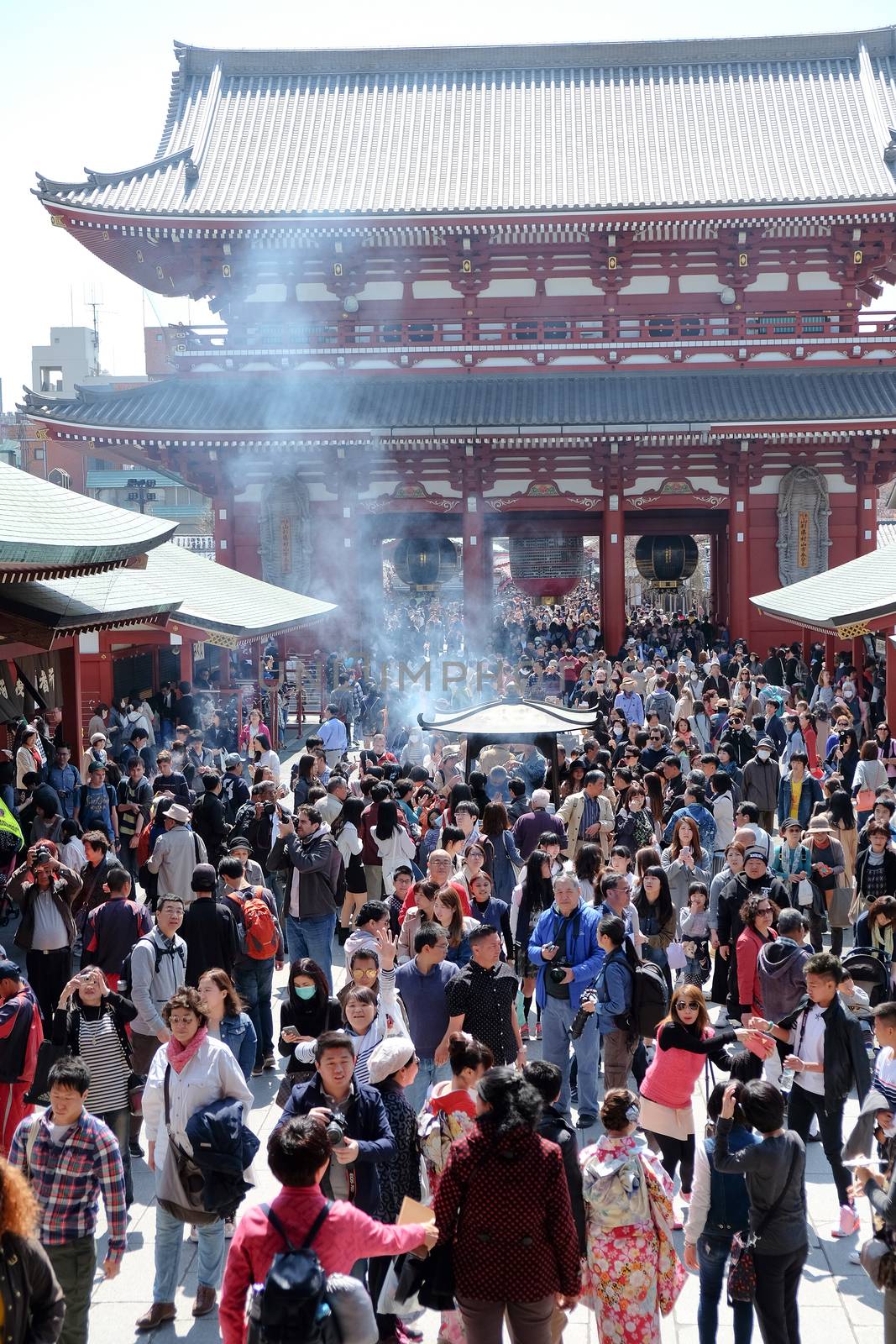 TOKYO, JAPAN - MARCH 29, 2016: unidentified people visit sensoji temple in Tokyo on 29 March 2016.. Sensoji temple is the most famous attraction in Asakusa, Tokyo, Japan