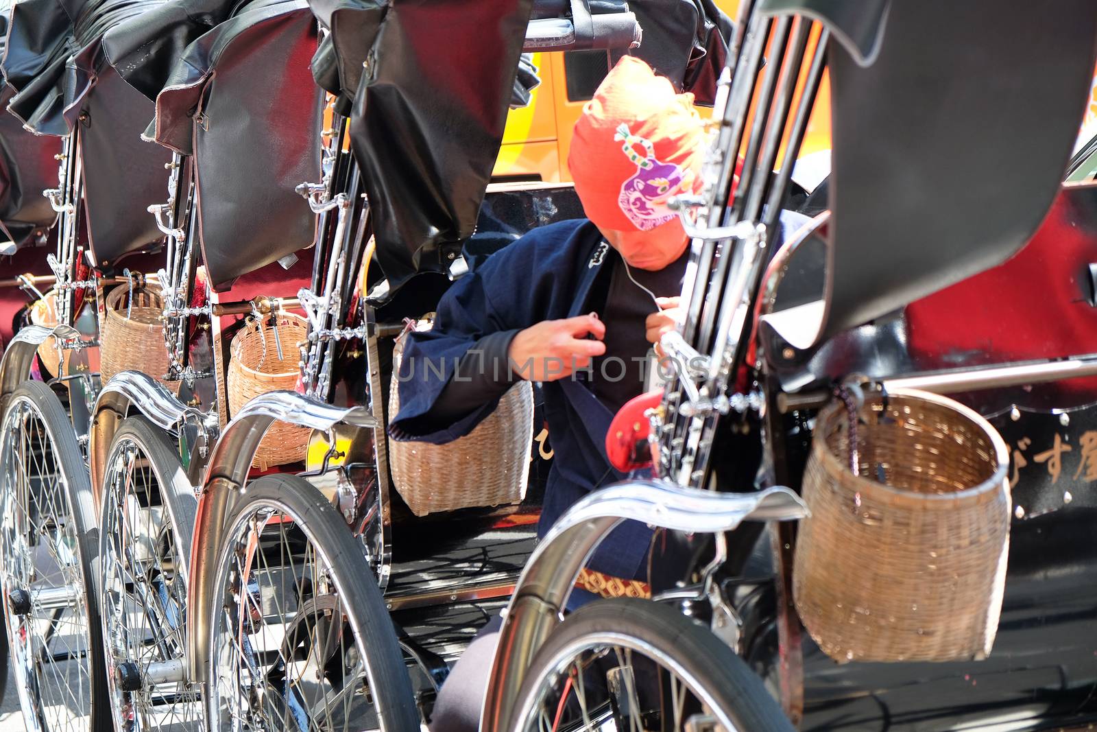 TOKYO, JAPAN - MARCH 29 2016 :rickshaw waiting area near the around Senso-ji Temple in Asakusa on March 29 2016. The Rickshaws are a popular way to tour the city.