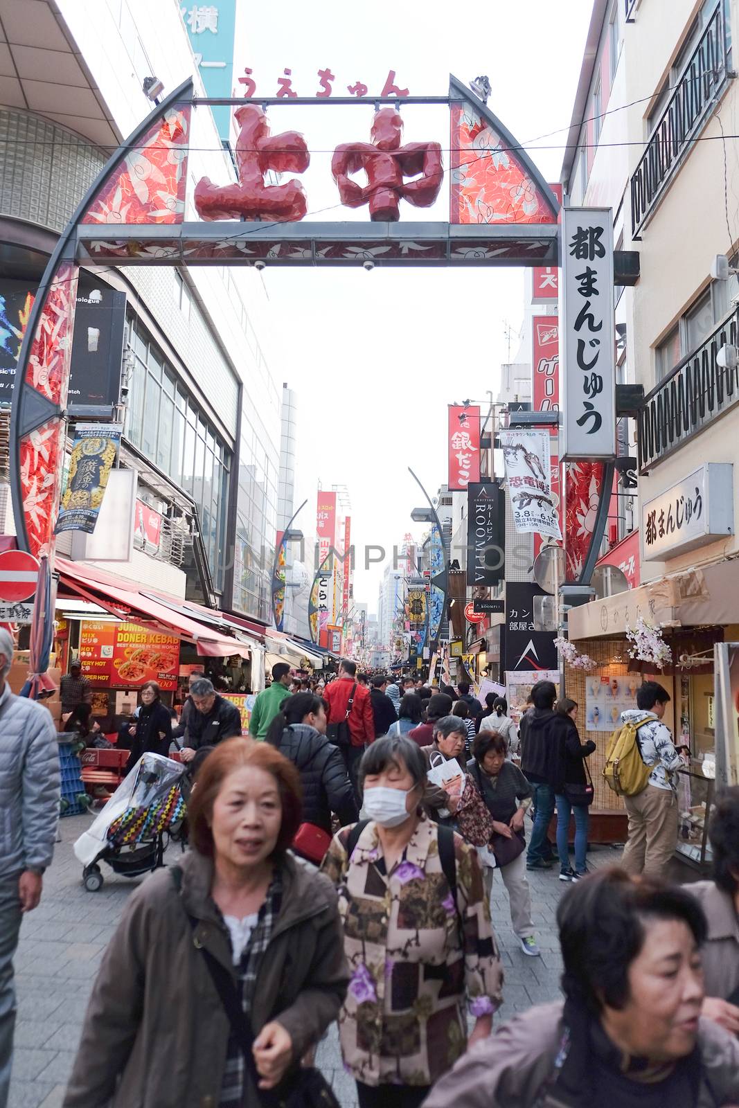 TOKYO, JAPAN - MARCH 29, 2016 : Crowded and busy Ameyoko shopping street on 29 March 2016.Today, various products such as clothes, bags, cosmetics, fresh fish, dried food are sold along Ameyoko.