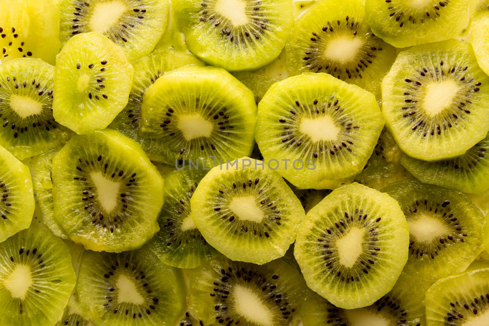 Fresh organic Kiwi Fruit Slices arranged showing the pips & structure