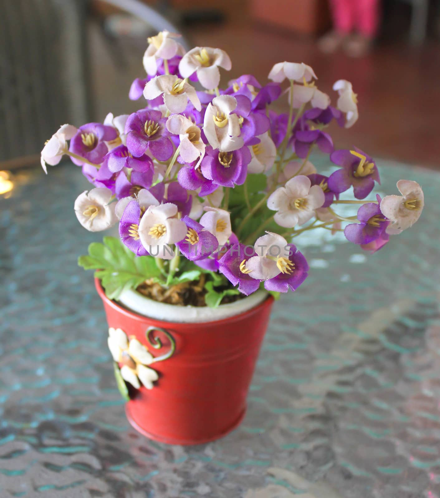 Small flower pots made of purple cloth.