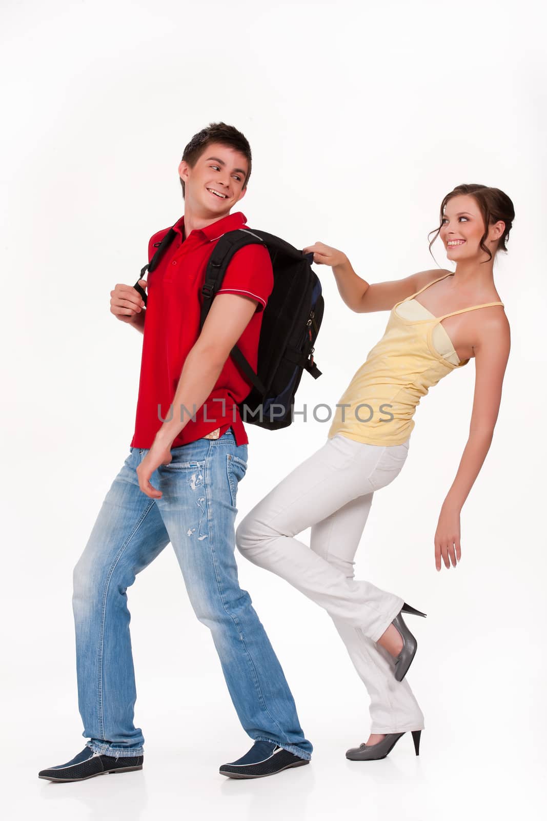 Young man and woman smiling on isolated background