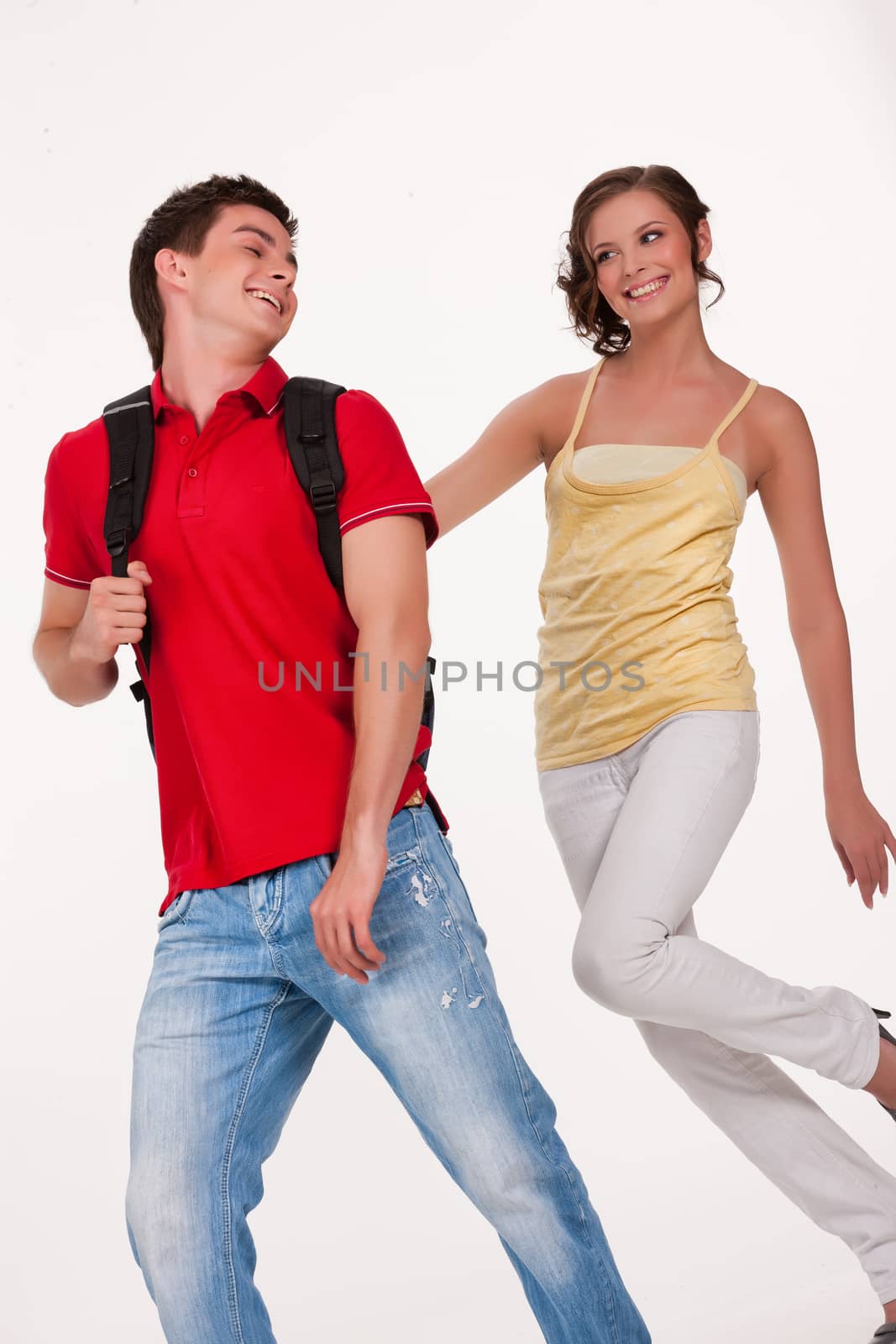 Young man and woman smiling on isolated background