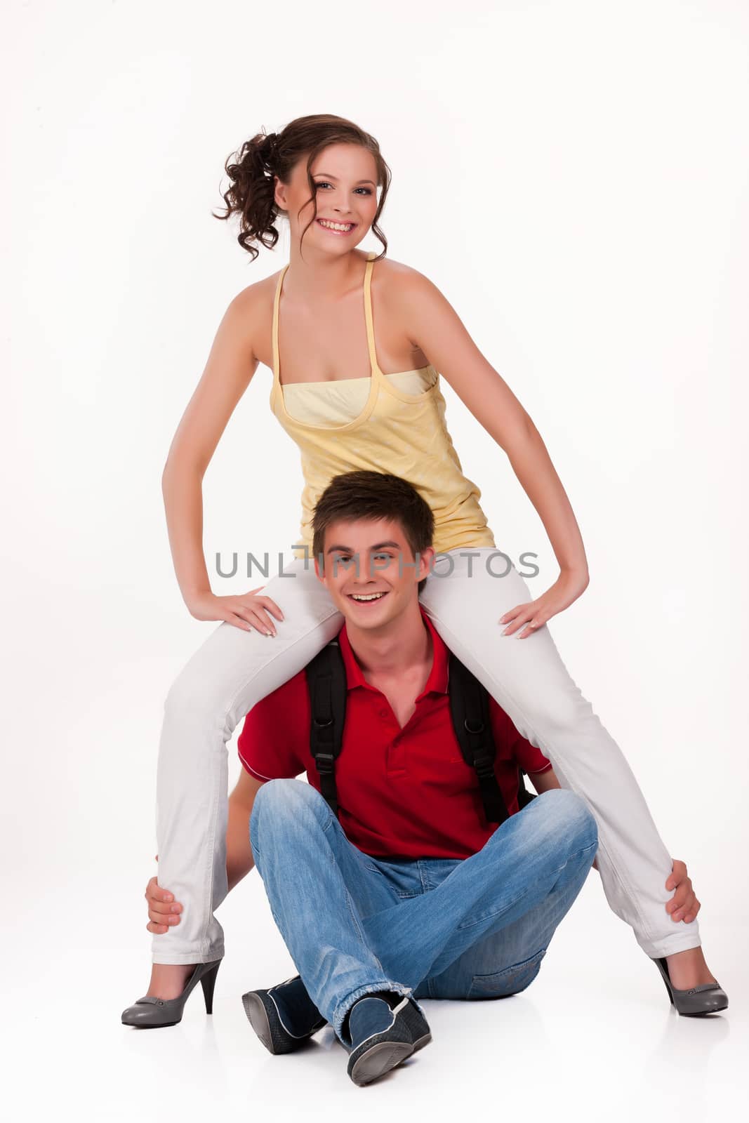 Young man and woman smiling on isolated background