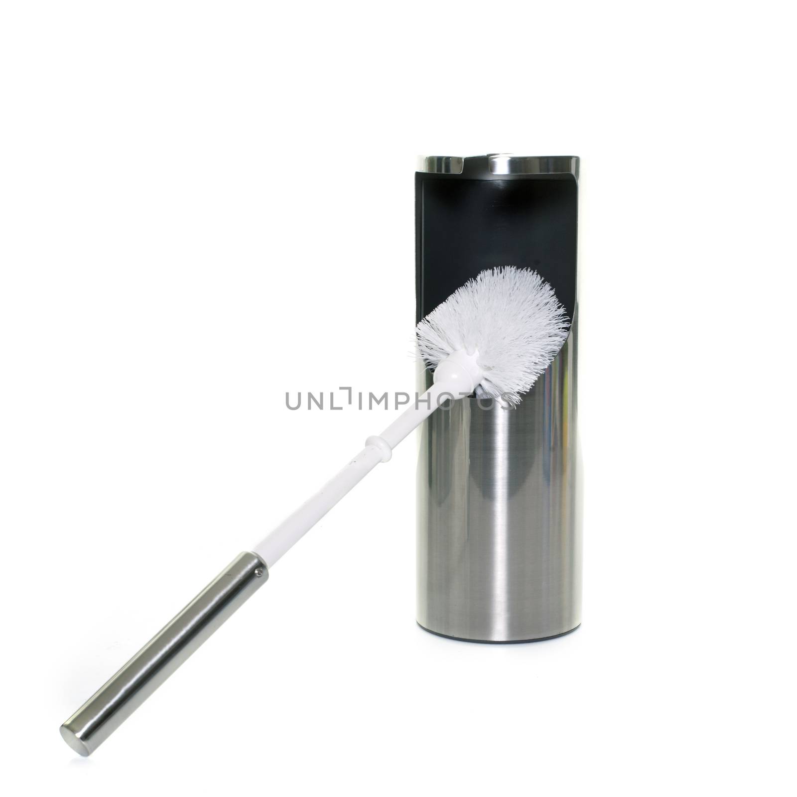 toilet brush in front of white background
