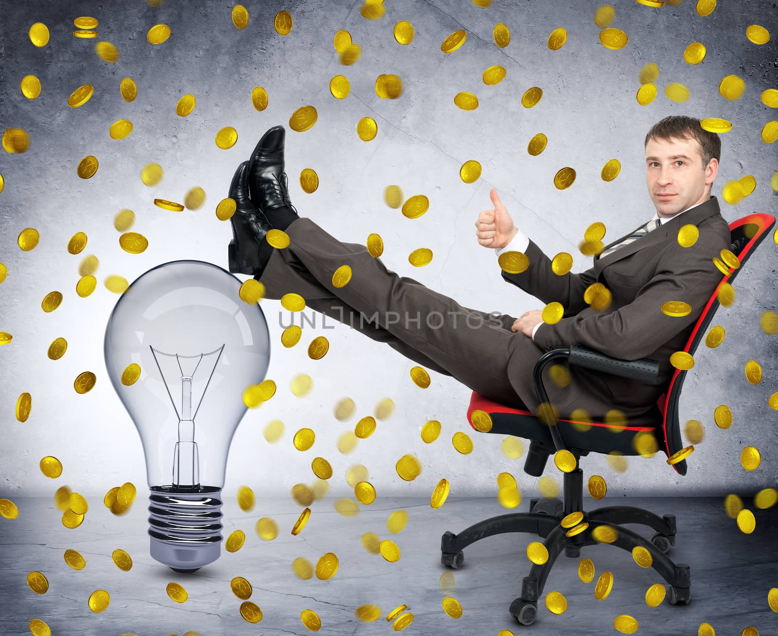 Businessman with light bulb under coin rain, idea is money concept