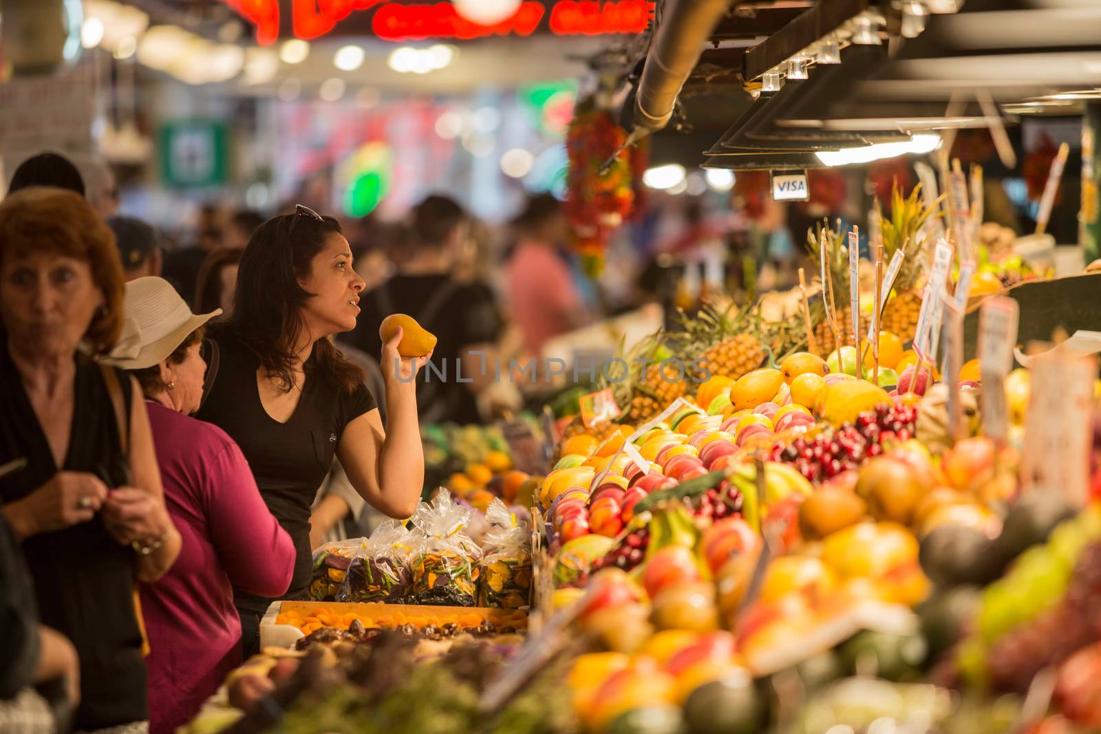 Woman Buying Fruit at Pike Street Market by Creatista