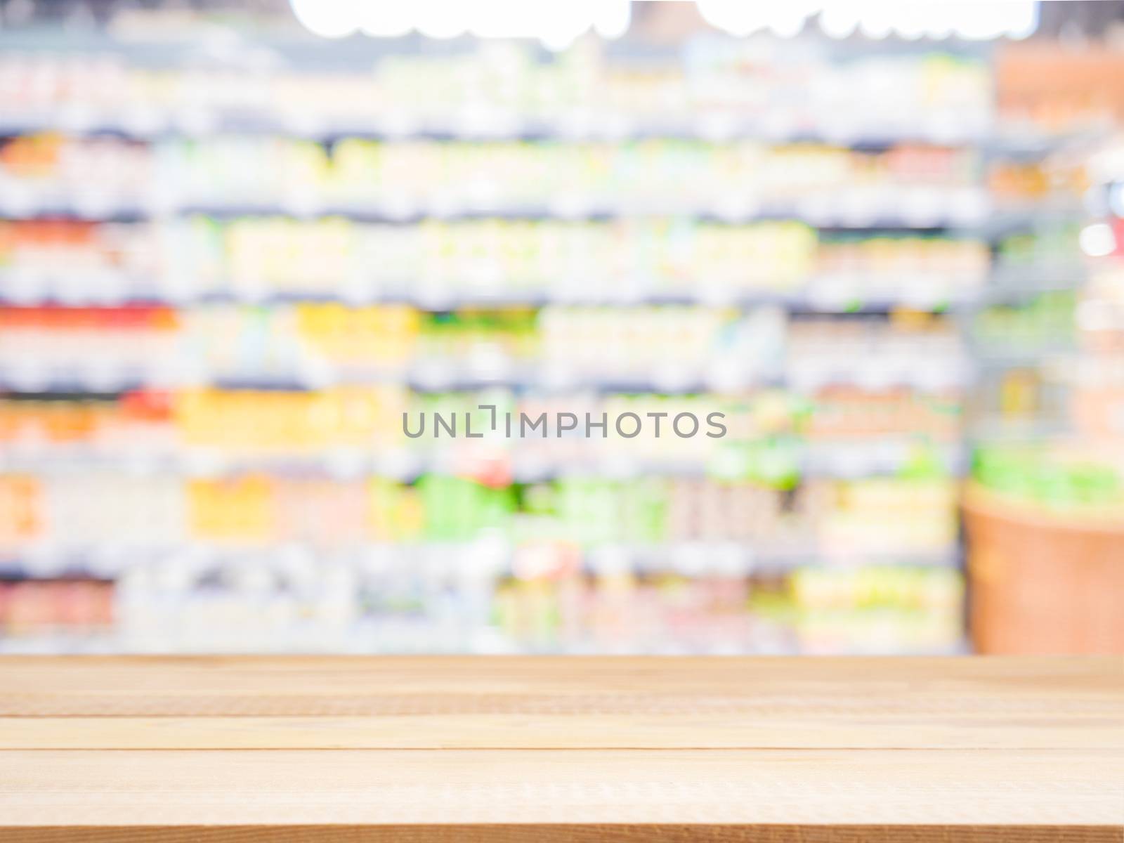 Wooden board empty table in front of blurred background. Perspective light wood over blur in supermarket - can be used for display or montage your products. Mock up for display of product.