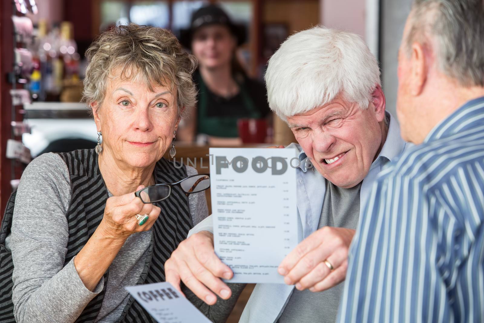 Mature Man Trying to Read Menu Without Glasses by Creatista