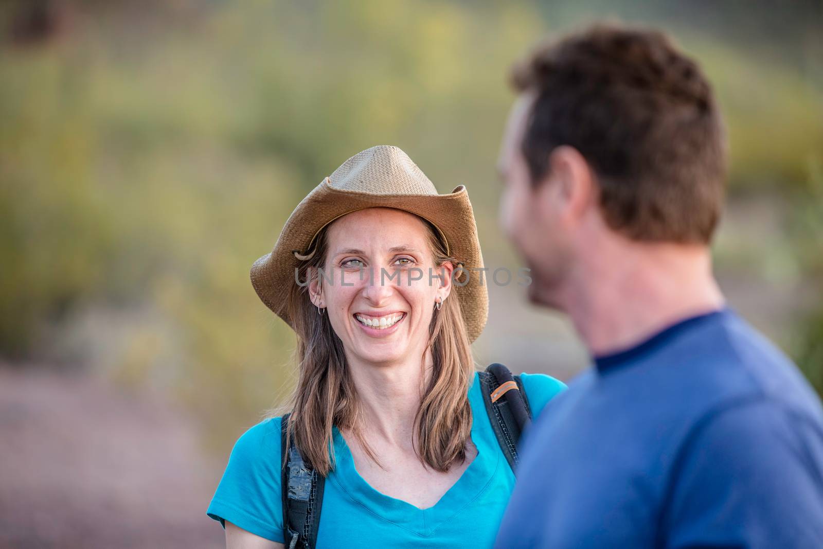 Smiling woman with man out for a nature hike