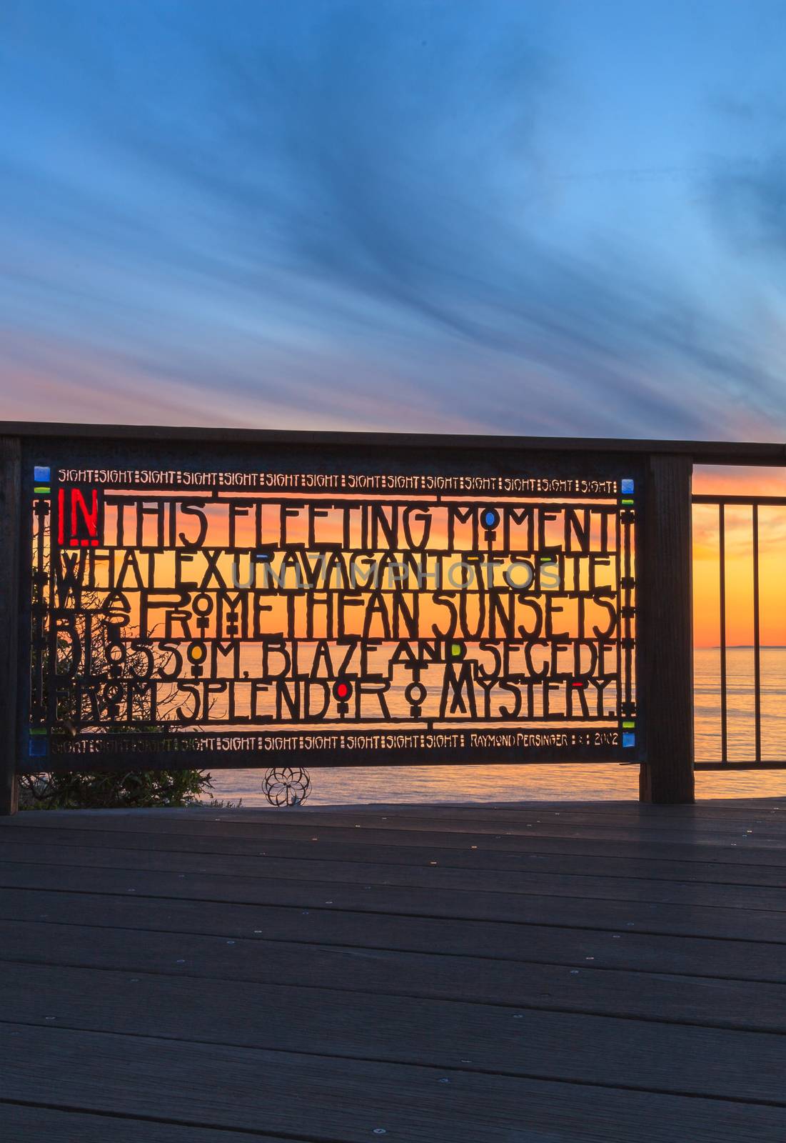 Laguna Beach, California, January 1, 2016: Stained glass fence at Browns Park by artist Raymond Persinger in Laguna Beach, California at sunset. Editorial use only.