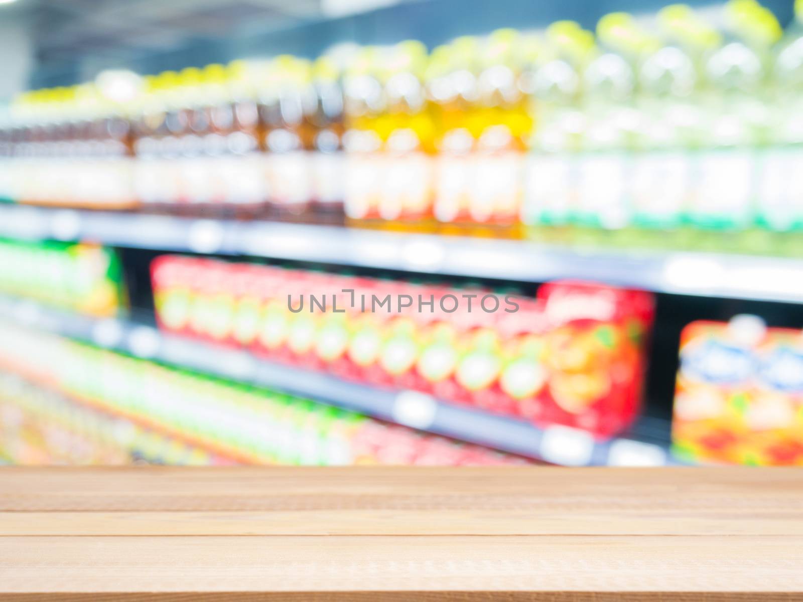 Wooden board empty table in front of blurred background. Perspective light wood over blur in supermarket - can be used for display or montage your products. Mock up for display of product.