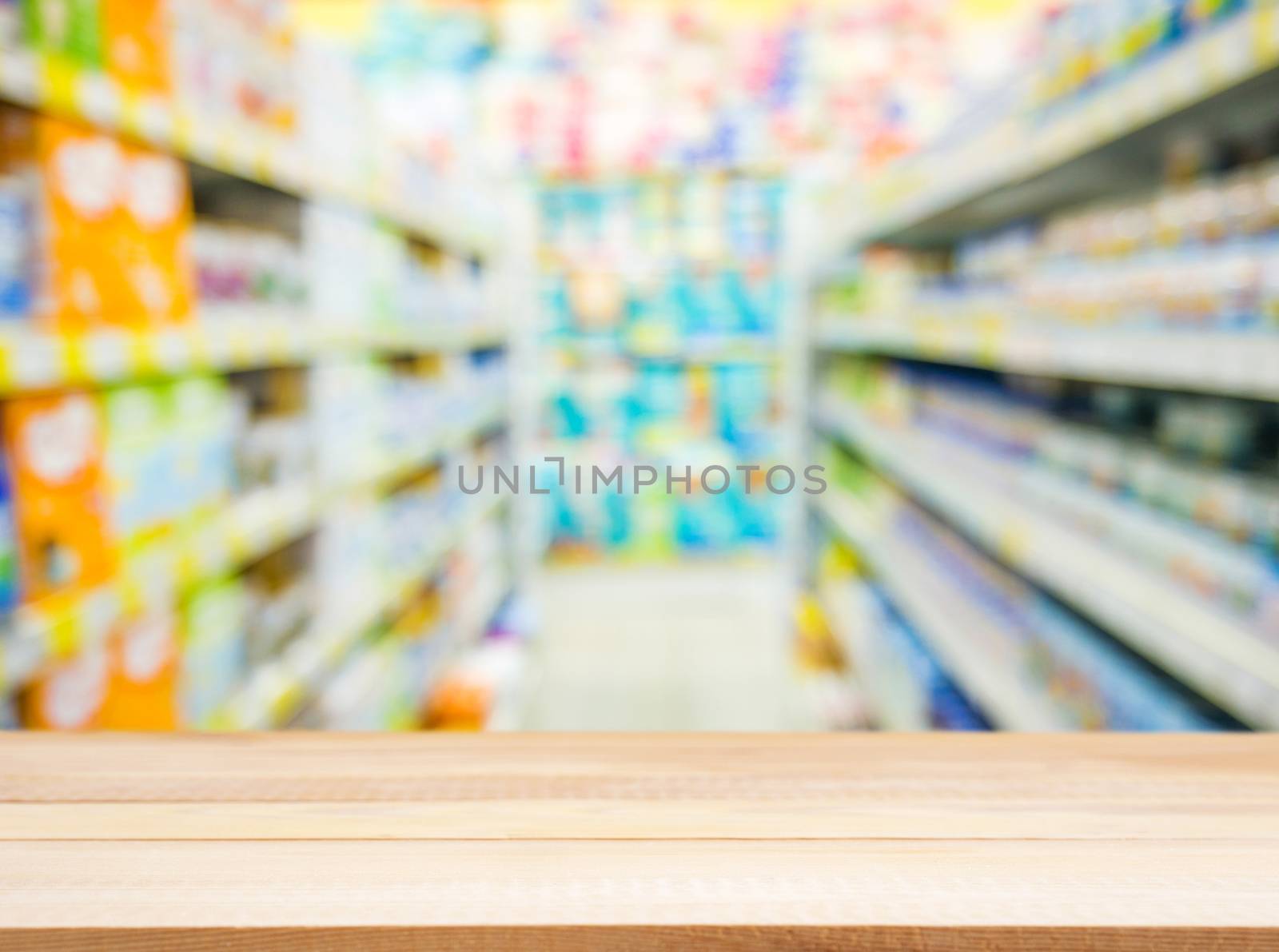 Wooden board empty table in front of blurred background. Perspective light wood over blur in kids toys store - can be used for display or montage your products. Mock up for display of product.