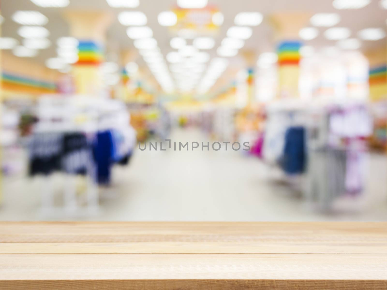 Wooden empty table in front of blurred background by fascinadora