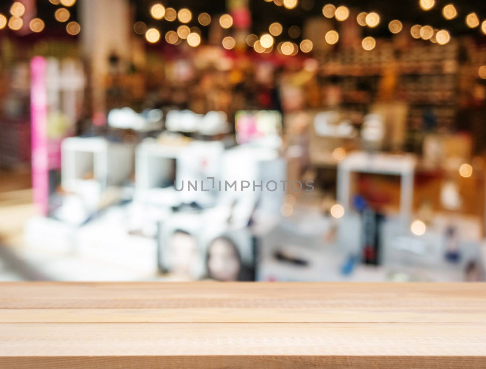 Wooden board empty table in front of blurred background. Perspective light wood over blur in shopping shoes store - can be used for display or montage your products. Mock up for display of product.