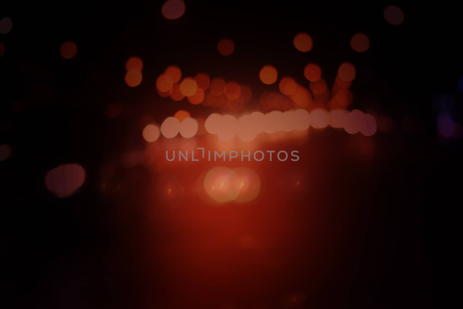 Orange light on a black bokeh background.