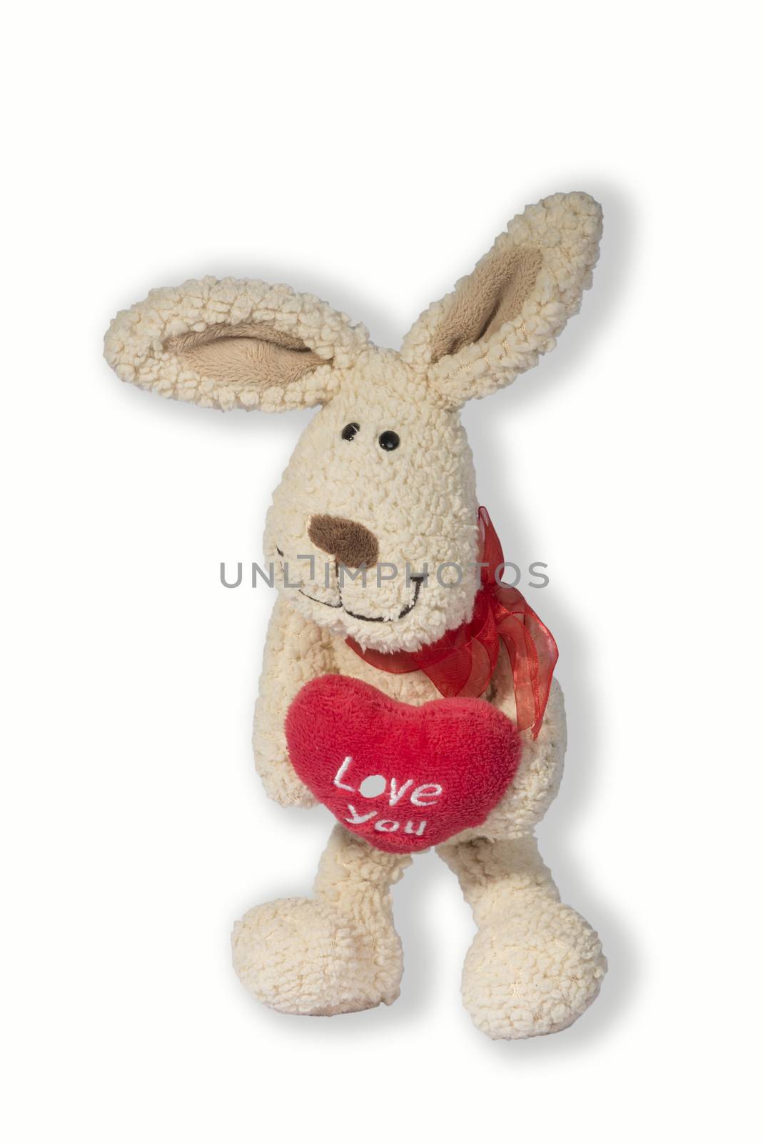 White toy rabbit holding a red heart with the inscription