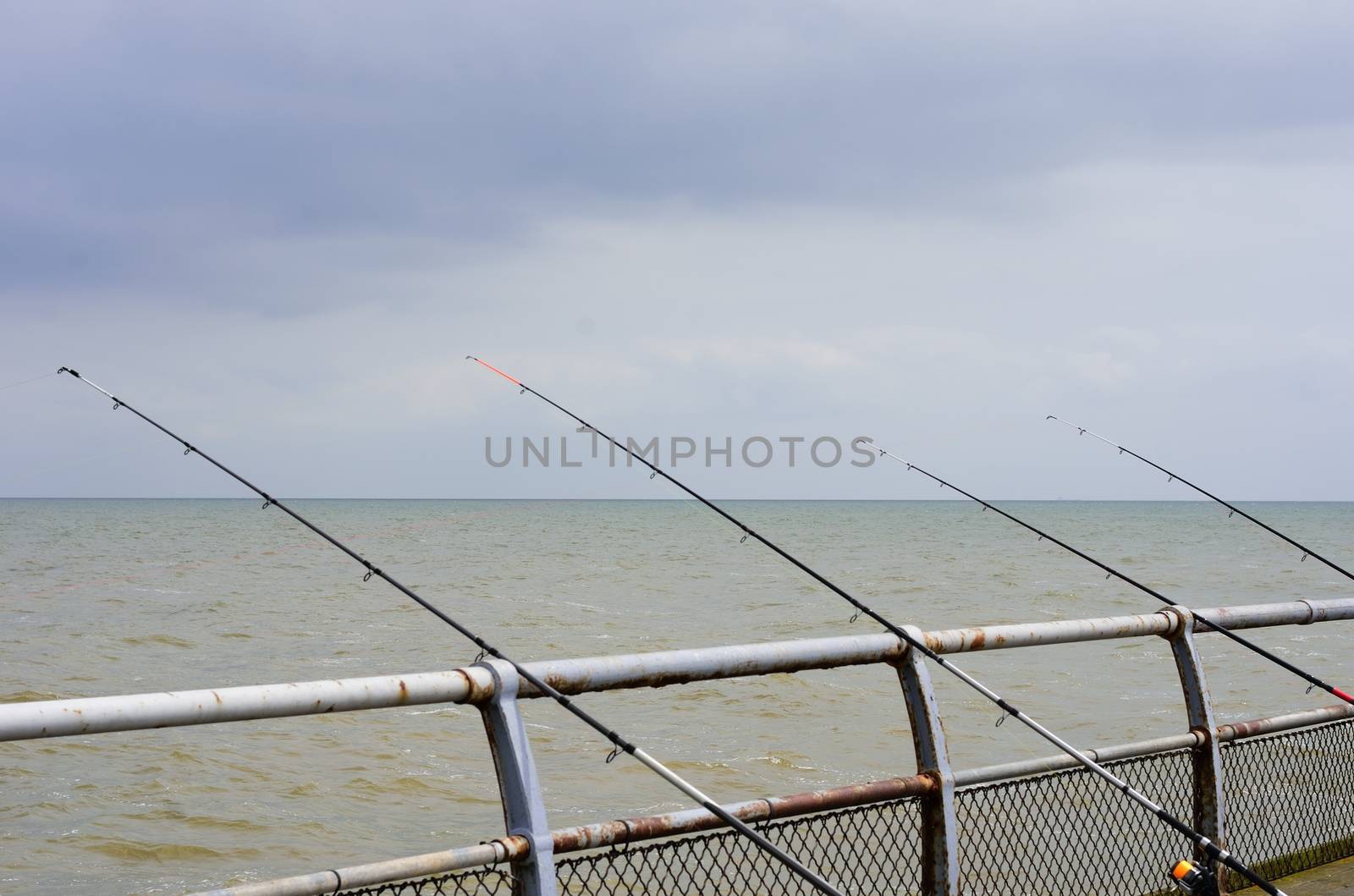 Sea fishing rods on pier