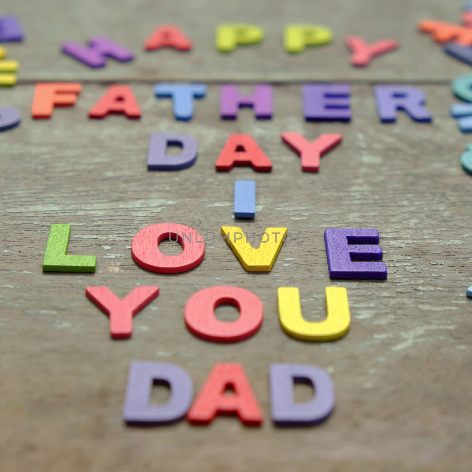 I love you dad message for father, group of colourful letters to happy father day, wooden alphabet wood background