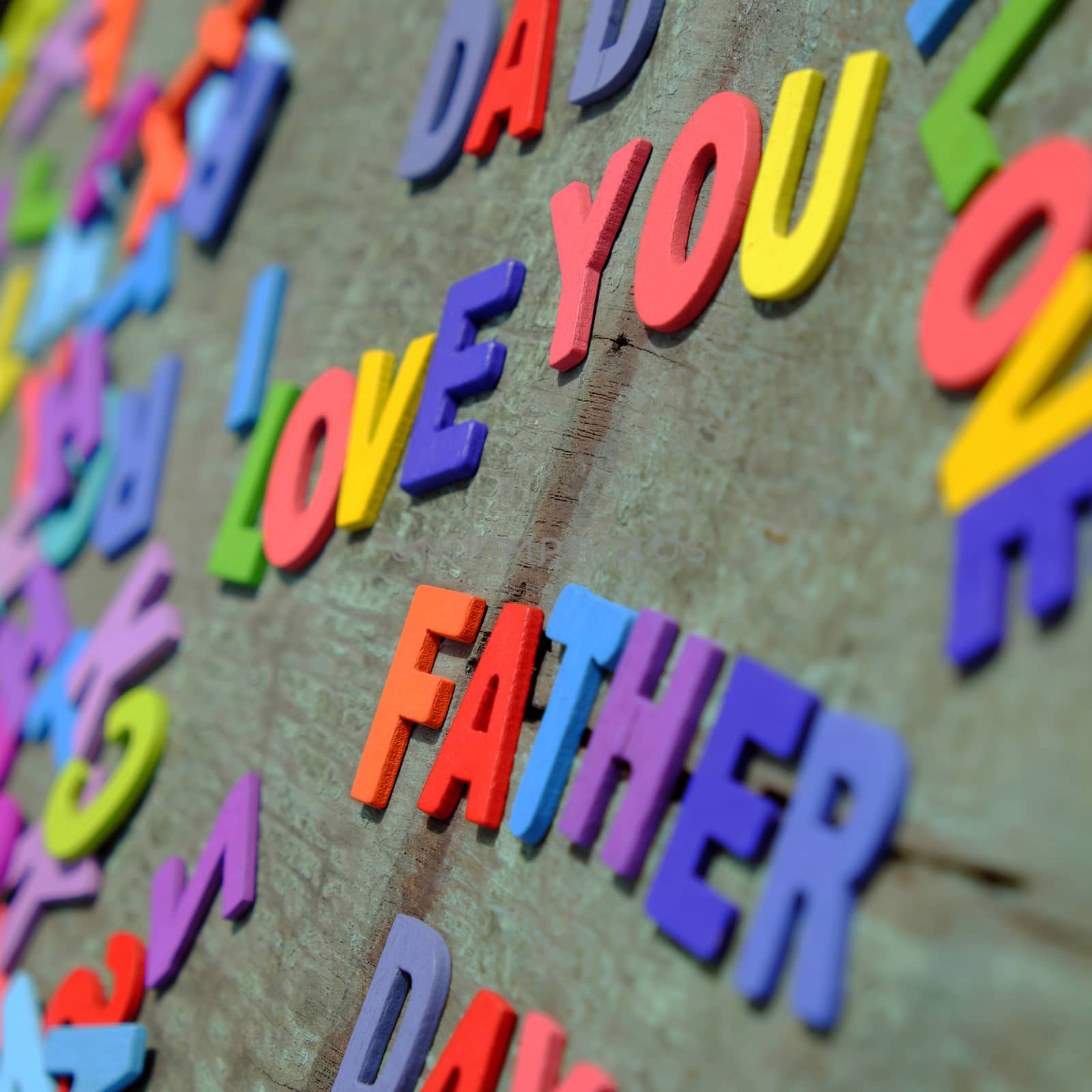 I love you dad message for father, group of colourful letters to happy father day, wooden alphabet wood background