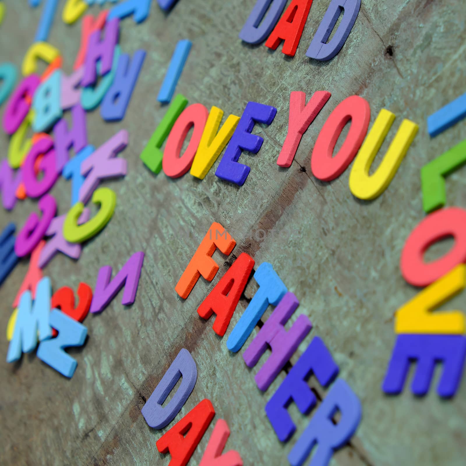 I love you dad message for father, group of colourful letters to happy father day, wooden alphabet wood background