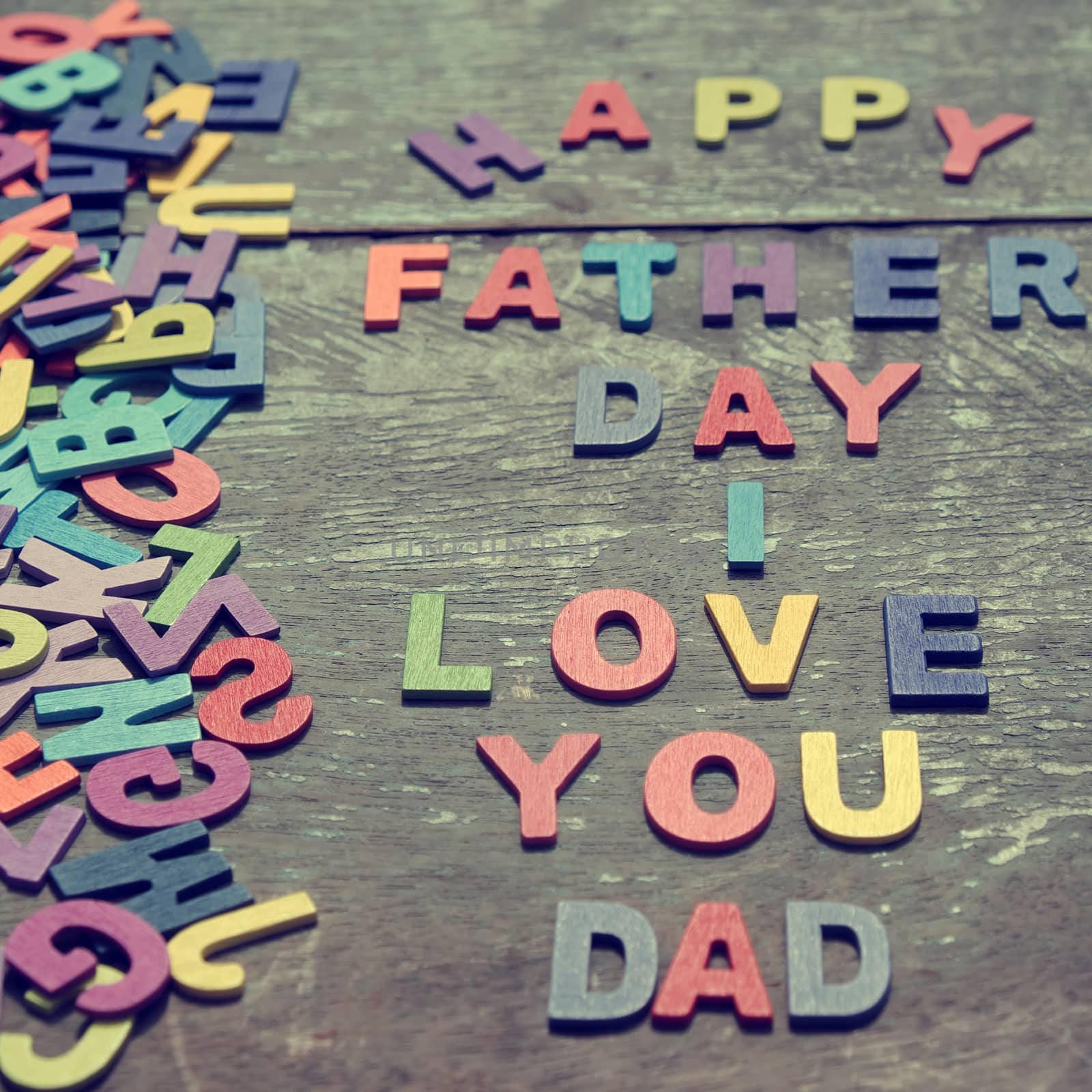I love you dad message for father, group of colourful letters to happy father day, wooden alphabet wood background