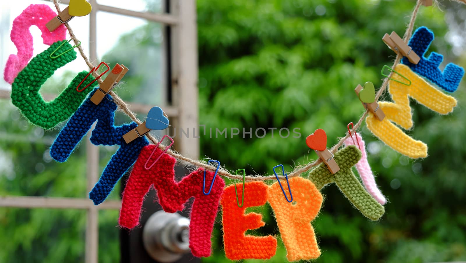 Summer letter hang on rope, summertime background with alphabet on green background