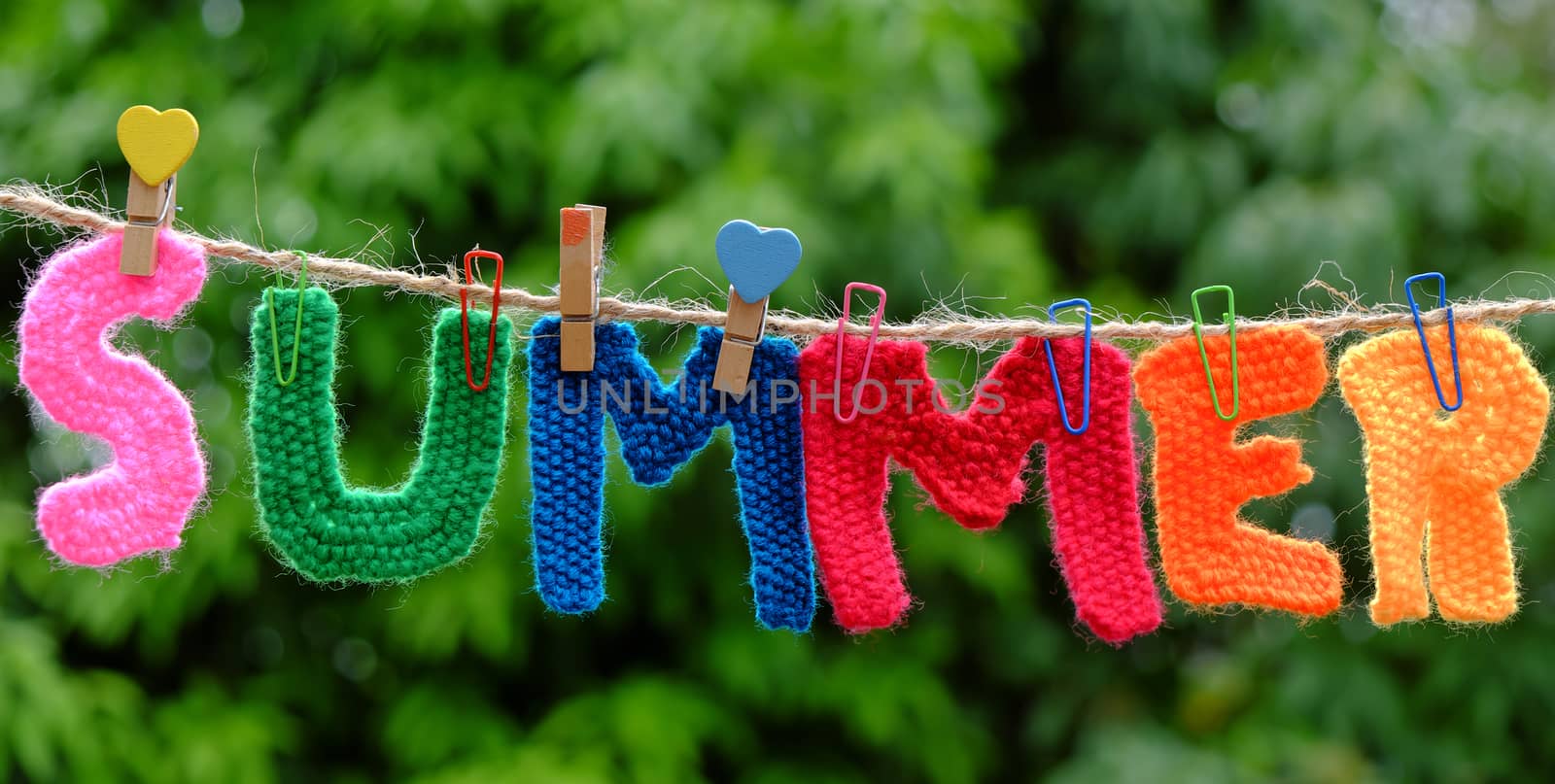 Summer letter hang on rope, summertime background with alphabet on green background